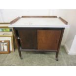 An oak cabinet with formica top