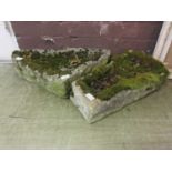 Two weathered stone troughs