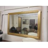 A gilt framed bevel glass mirror