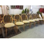 A set of six (five plus one) Ercol dining chairsMinor marks and stains throughout. Small chips to