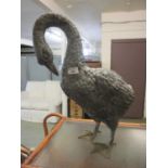 A metal garden ornament in the form of a goose