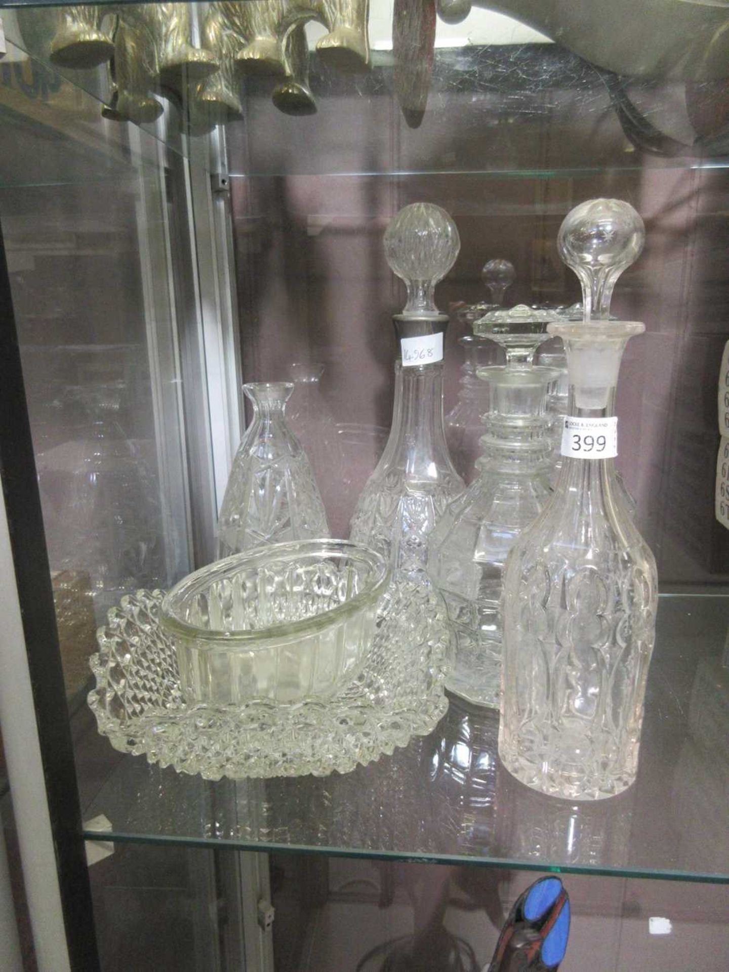 A selection of cut and pressed glassware to include decanters and bowls