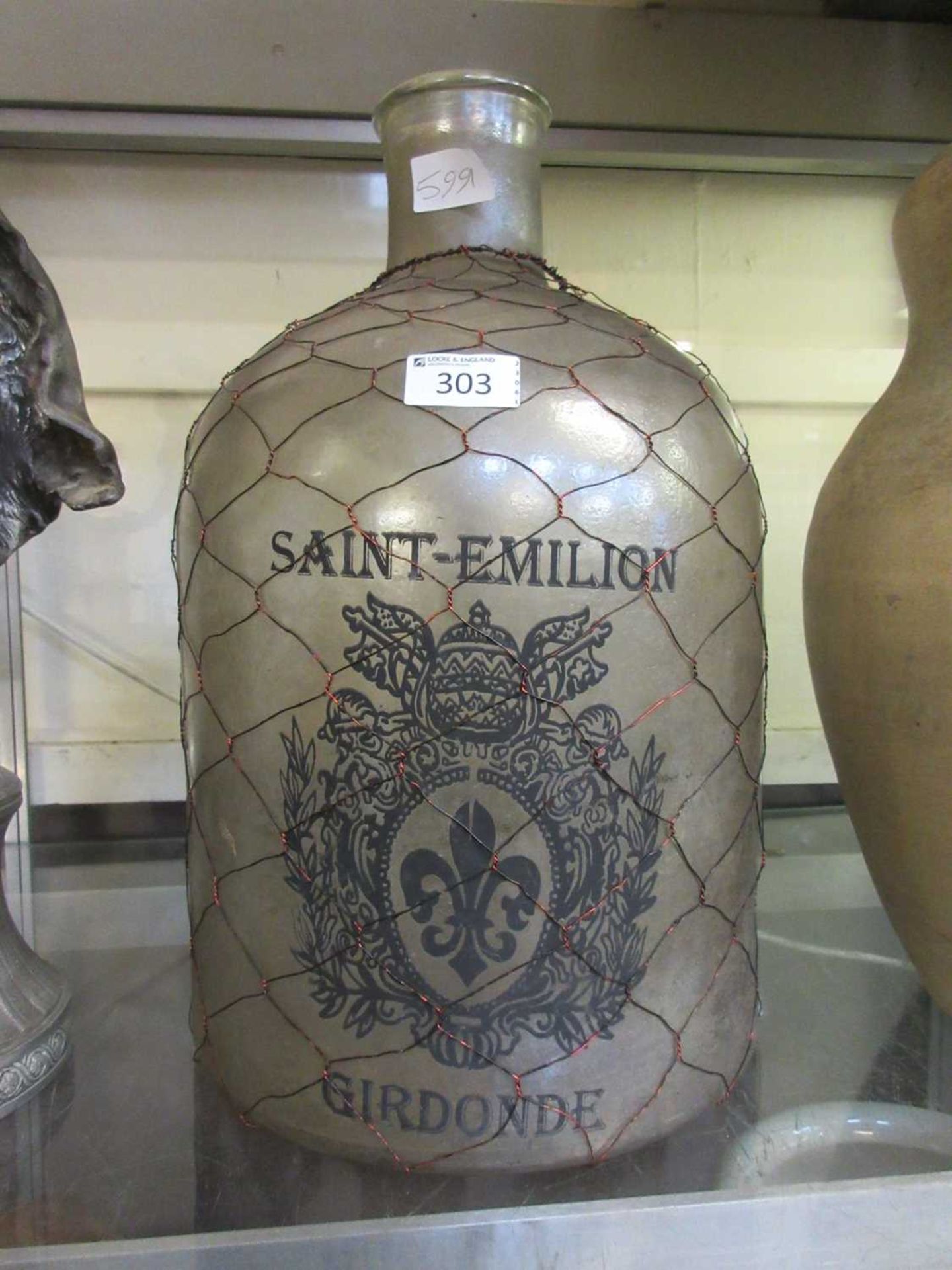 An oversized glass bottle reading 'St Emilion, Girdonde'