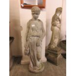 A composite stone garden statue of classical lady