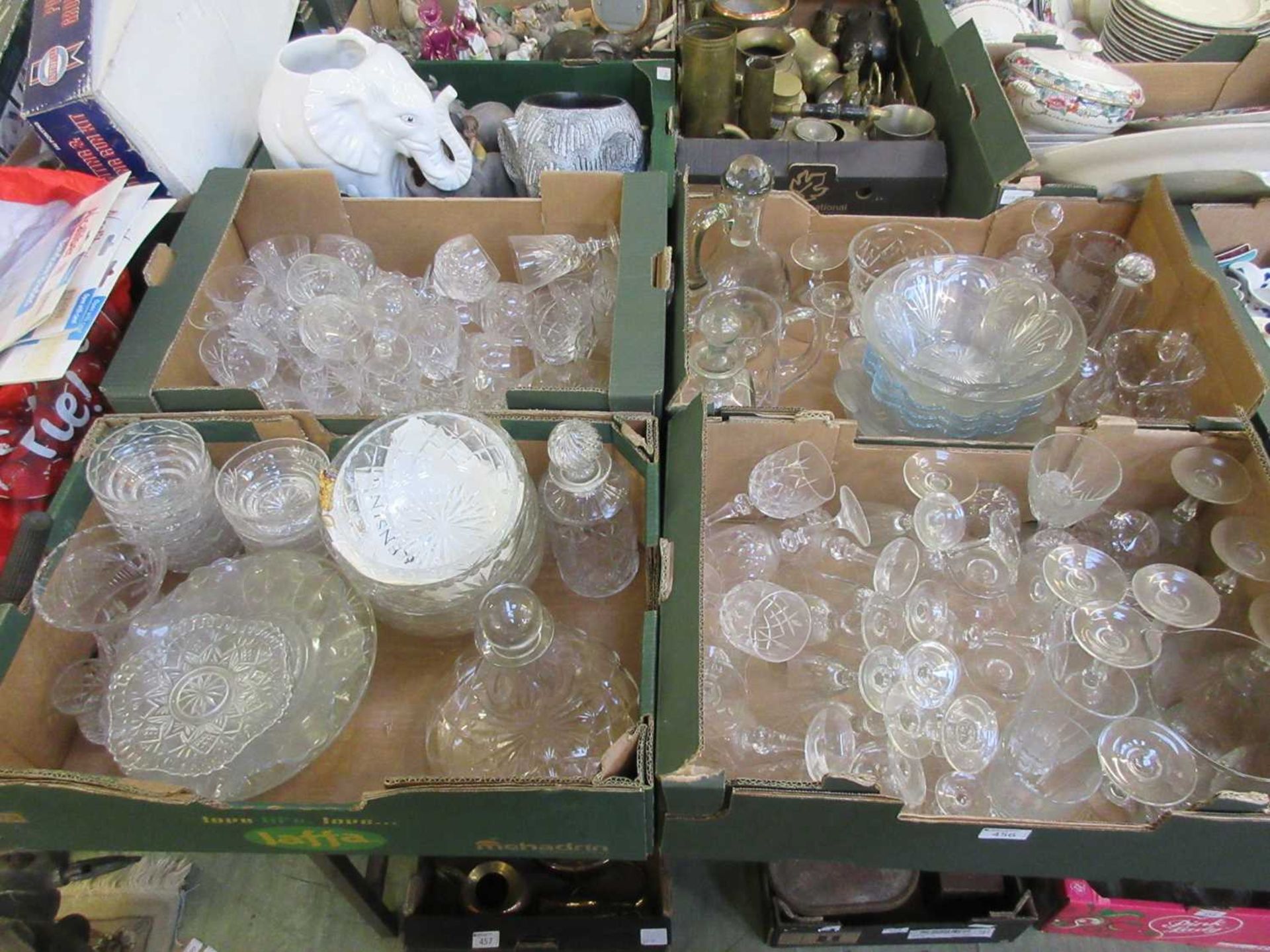 Four trays of table glassware to include decanters, drinking vessels, bowls, etc