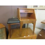 A mid-20th century 'Chippy' teak telephone table