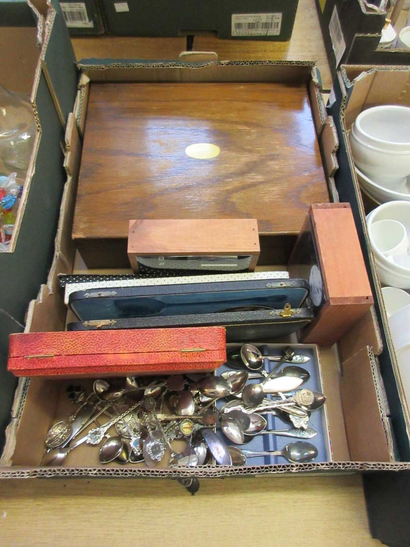 A tray containing cased and uncased flatware