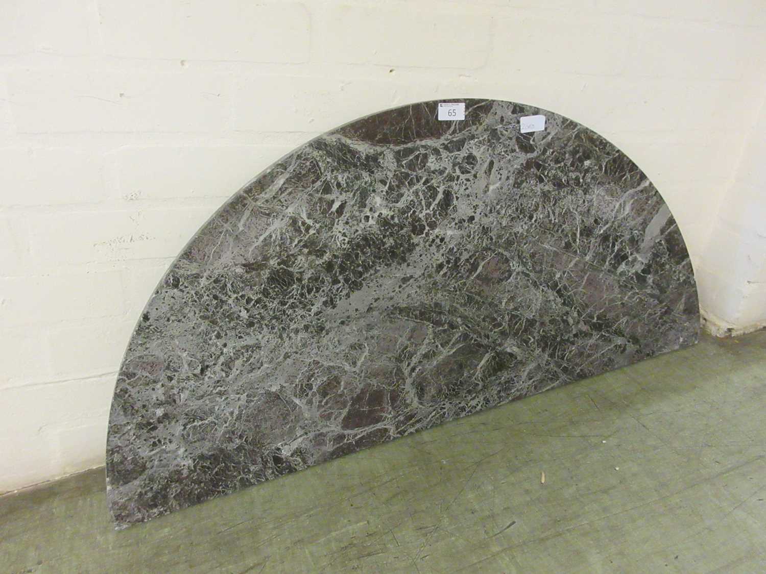 A semi-circular marble table top