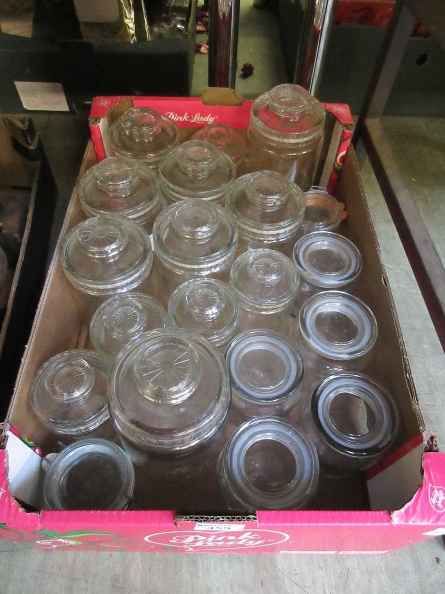 A tray of glass storage jars