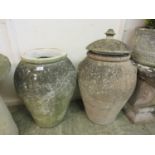 Two composite stone garden urns, one with lidDimensions: H, 58cm , Diameter, 44cm.