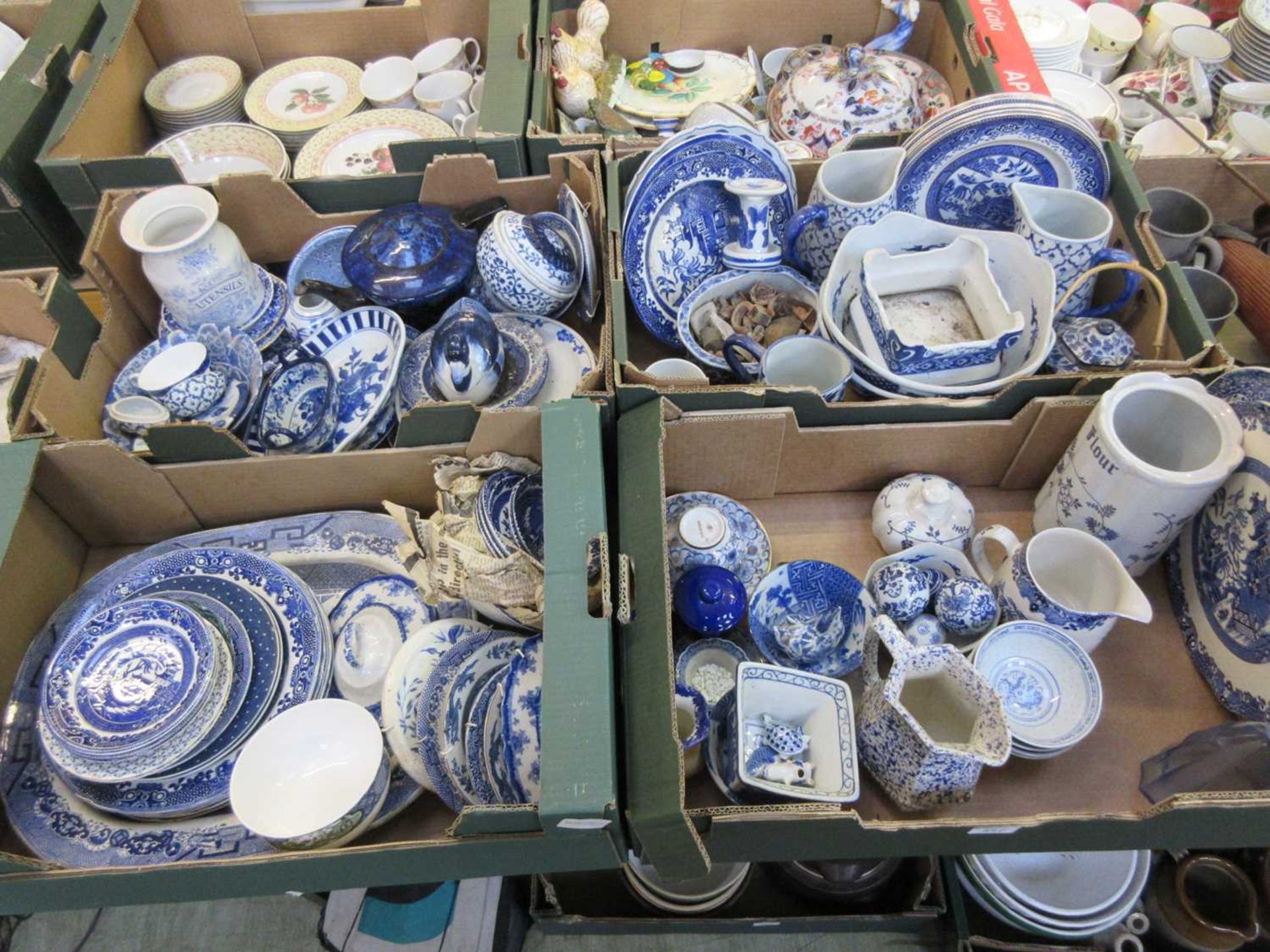 Four trays of blue and white ceramic tableware