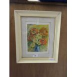 A framed and glazed artwork of flowers signed Kane