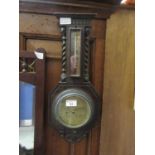 An early 20th century oak cased barometer