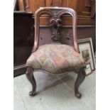 A 19th century mahogany single chair with carved and pierced splat on cabriole legs