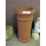 A terracotta chimney pot