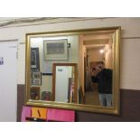 A gilt framed bevel glass rectangular mirror