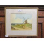 A framed and glazed watercolour of windmill scene signed bottom left