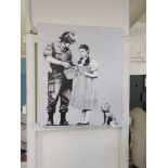 An unframed canvas print after Banksy