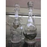 Two glass decanters, one having a pewter label 'London Taxi'