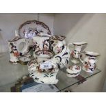 A collection of Mason's and other ceramic tableware to include jugs, cups, storage jars, etc