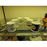 A collection of six Royal Crown Derby commemorative mugs