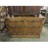 An Ercol elm cabinet with two panelled doorsDimensions; H, 70cm , W, 98cm , D, 50cm.