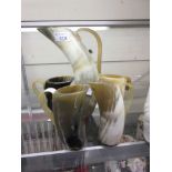 An ox horn pitcher and four tankards