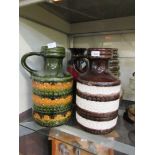 Four assorted West German glazed vases, two having handle