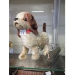 A mid-20th century battery operated dog
