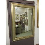 A gilt framed bevel glass rectangular mirror