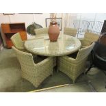 A garden set comprising of six armchairs and a circular tableThe chairs in this lot do not come with