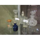 A selection of glass canisters to include sugar sifter, etc