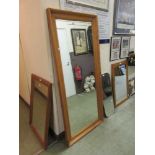 A large modern pine framed mirror