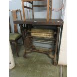 An early 20th century cast iron mangle with wooden tabletop