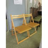 A pair of folding chairs