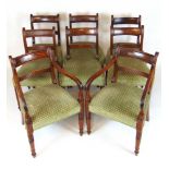 A set of eight (6+2) early 19th century mahogany dining chairs upholstered in a patterned green