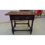 A late 17th century and later oak side table, the cleated top over a single drawer on turned legs