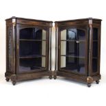 A pair of late 19th century ebonised, boxwood strung and brass mounted vitrine/pier cabinets, the
