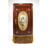 A 19th century French mahogany and brass mounted cabinet, the marble top over the door with