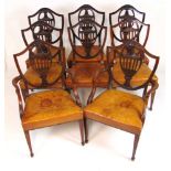 A set of eight early 20th century Hepplewhite style dining chairs upholstered in tan leather, the