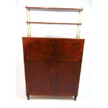 A Regency rosewood, tulipwood banded and boxwood strung secretaire cabinet, the top with two shelves