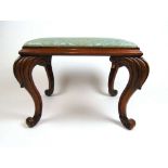 A 19th century walnut stool, the pad seat upholstered in a floral patterned blue silk fabric on