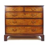 An 18th century mahogany commode chest of drawers, the moulded top over two short and three long
