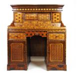 An early 20th century Japanese parquetry desk, the superstructure with cupboards and drawers on