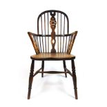 An early 20th century elm, oak and beech Windsor chair, the hoop back with pierced splat on turned