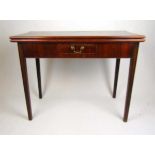 A late 18th century mahogany tea table, the fold over top supported on a single gate action over