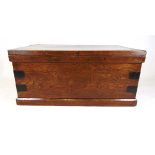 A 19th century elm trunk, the top lifting to reveal a paper lined interior over iron carry