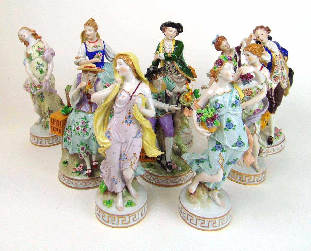 A collection of nine 20th century Sitzendorf porcelain figures to include a dancing couple, lady
