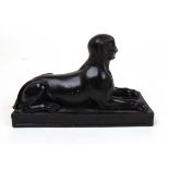 A Wedgwood black basalt model of a Sphinx, l. 15 cm Believed to have been overpainted. See images of