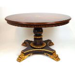 An early 19th century style parcel gilt and specimen wood centre table, the Ceylonese inspired top